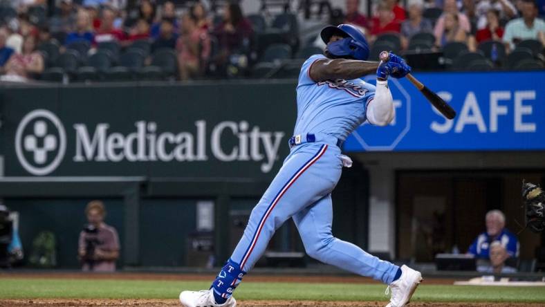 Sep 3, 2023; Arlington, Texas, USA; Texas Rangers right fielder Adolis Garcia (53) hits a walk off home run for the win over the Minnesota Twins during the ninth inning at Globe Life Field. Mandatory Credit: Jerome Miron-USA TODAY Sports