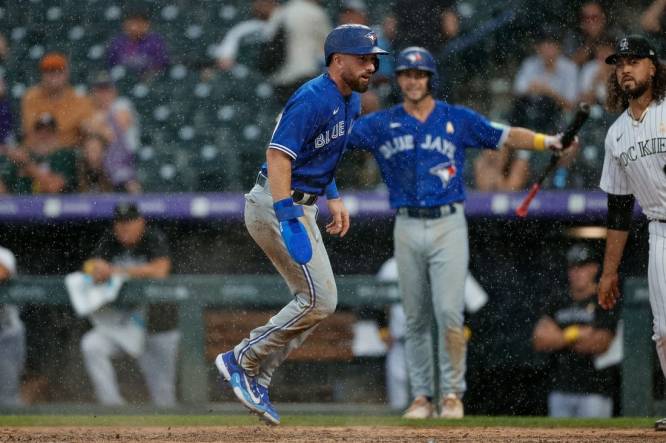 Sep 3, 2023; Denver, Colorado, USA; Toronto Blue Jays shortstop Mason McCoy (10) scores on an RBI in the ninth inning against the Colorado Rockies at Coors Field. Mandatory Credit: Isaiah J. Downing-USA TODAY Sports