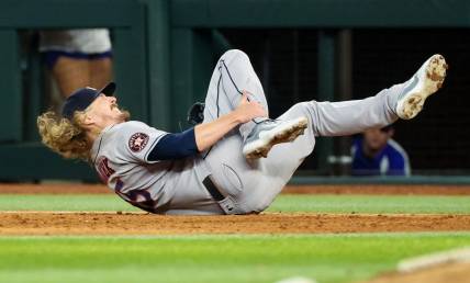 Sep 4, 2023; Arlington, Texas, USA;  Houston Astros relief pitcher Ryne Stanek (45) injures himself during the ninth inning against the Texas Rangers at Globe Life Field. Mandatory Credit: Kevin Jairaj-USA TODAY Sports