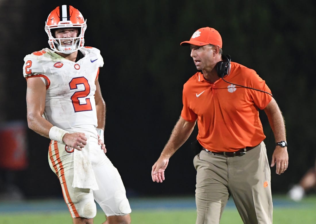 Sep 4, 2023; Durham, North Carolina, USA; Clemson Tigers quarterback Cade Klubnik (2)  talks with head coach Dabo Swinney during the fourth quarter of the season opening game at Wallace Wade Stadium in Durham, N.C. Mandatory Credit: Ken Ruinard-USA TODAY Sports