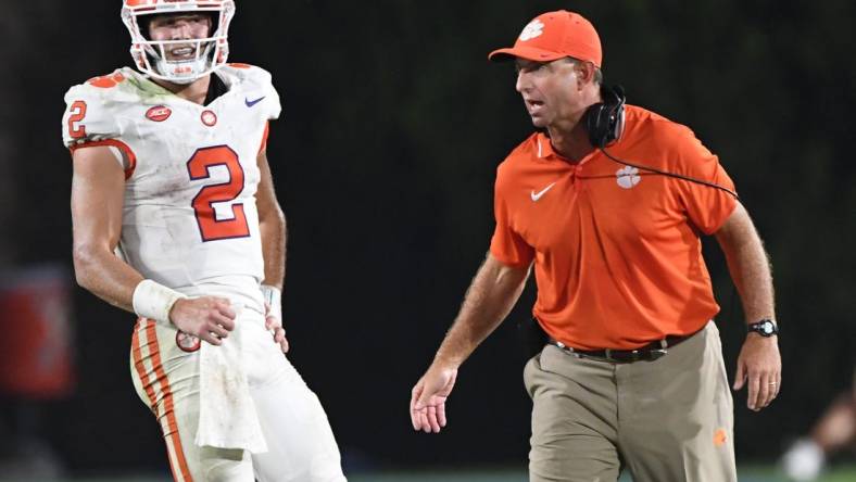 Sep 4, 2023; Durham, North Carolina, USA; Clemson Tigers quarterback Cade Klubnik (2)  talks with head coach Dabo Swinney during the fourth quarter of the season opening game at Wallace Wade Stadium in Durham, N.C. Mandatory Credit: Ken Ruinard-USA TODAY Sports