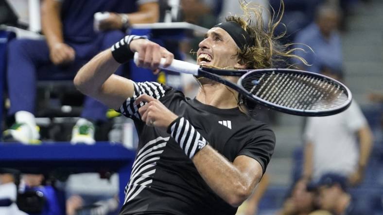 Sep 4, 2023; Flushing, NY, USA; Alexander Zverev of Germany hits a ball into the crowd after defeating Jannik Sinner of Italy on day eight of the 2023 U.S. Open tennis tournament at USTA Billie Jean King National Tennis Center. Mandatory Credit: Danielle Parhizkaran-USA TODAY Sports