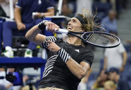 Sep 4, 2023; Flushing, NY, USA; Alexander Zverev of Germany hits a ball into the crowd after defeating Jannik Sinner of Italy on day eight of the 2023 U.S. Open tennis tournament at USTA Billie Jean King National Tennis Center. Mandatory Credit: Danielle Parhizkaran-USA TODAY Sports
