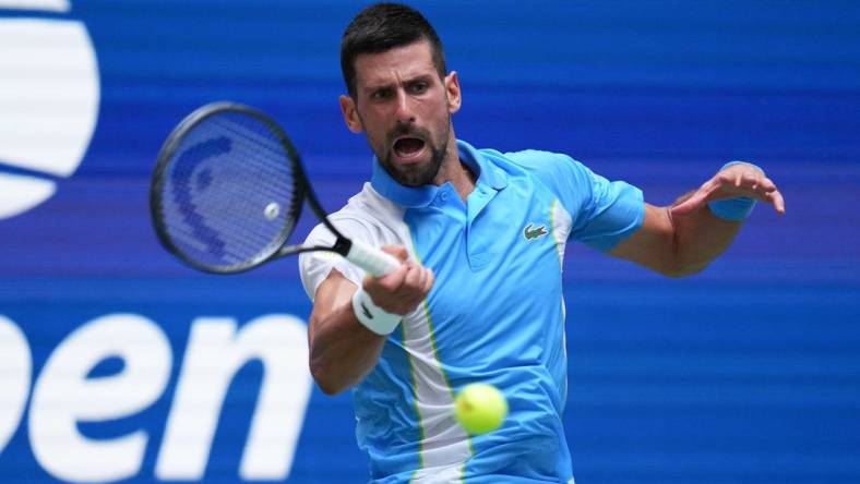 Sep 5, 2023; Flushing, NY, USA; Novak Djokovic of Serbia hits to Taylor Fritz of the United States on day nine of the 2023 U.S. Open tennis tournament at USTA Billie Jean King National Tennis Center. Mandatory Credit: Danielle Parhizkaran-USA TODAY Sports