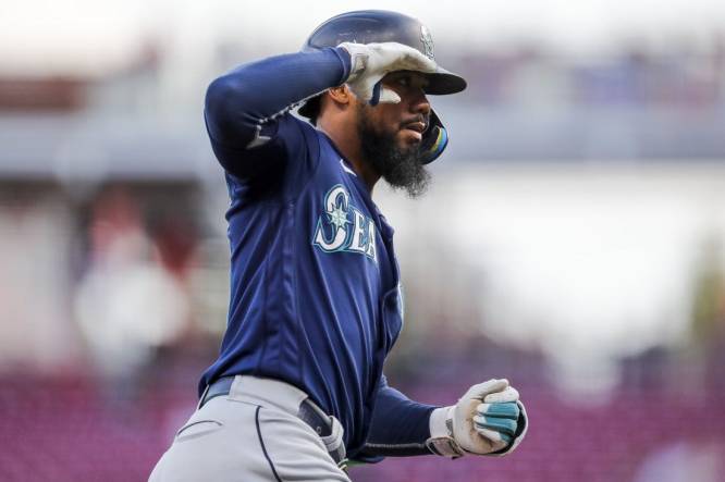 Sep 5, 2023; Cincinnati, Ohio, USA; Seattle Mariners right fielder Teoscar Hernandez (35) reacts after hitting a two-run home run in the first inning against the Cincinnati Reds at Great American Ball Park. Mandatory Credit: Katie Stratman-USA TODAY Sports