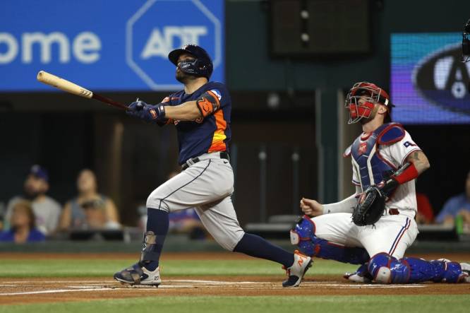 Sep 5, 2023; Arlington, Texas, USA; Houston Astros second baseman Jose Altuve (27) hits a solo home run in the first inning against the Texas Rangers at Globe Life Field. Mandatory Credit: Tim Heitman-USA TODAY Sports