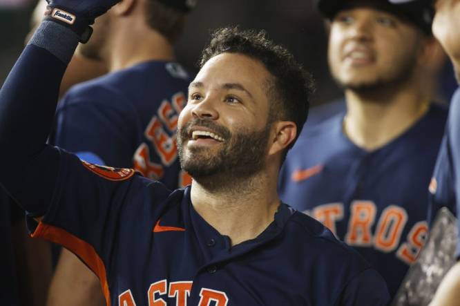 Sep 5, 2023; Arlington, Texas, USA; Houston Astros second baseman Jose Altuve (27) is congratulated by his teammates after hitting a solo home run in the first inning against the Texas Rangers at Globe Life Field. Mandatory Credit: Tim Heitman-USA TODAY Sports