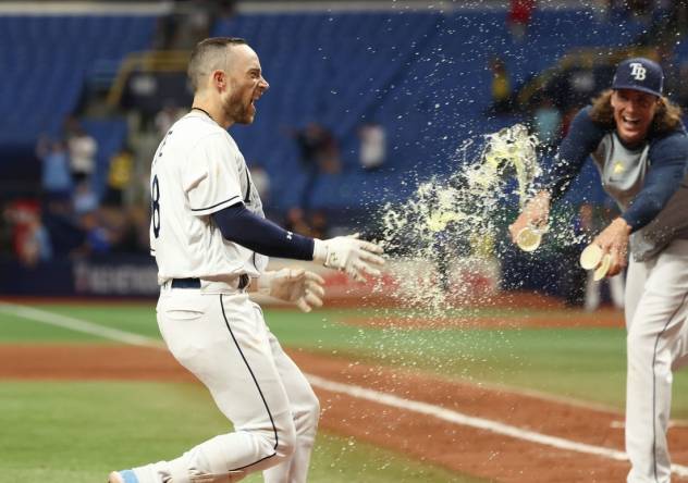 Sep 5, 2023; St. Petersburg, Florida, USA; Tampa Bay Rays second baseman Brandon Lowe (8) celebrates after he hit a three run walk off home run during the eleventh inning against the Boston Red Sox  at Tropicana Field. Mandatory Credit: Kim Klement Neitzel-USA TODAY Sports