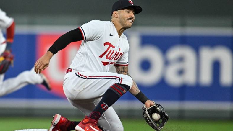 Aug 26, 2023; Minneapolis, Minnesota, USA; Minnesota Twins shortstop Carlos Correa (4) in action against the Texas Rangers during the eighth inning at Target Field. Mandatory Credit: Jeffrey Becker-USA TODAY Sports