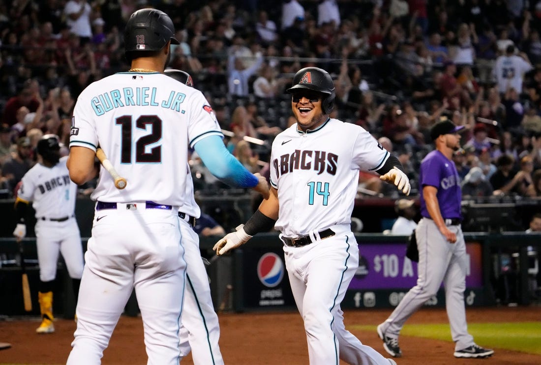 Arizona Diamondbacks Gabriel Moreno (14) scores on a 2-RBI-double by Jace Peterson (6) against the Colorado Rockies in the fourth inning at Chase Field in Phoenix on Sept. 4, 2023.