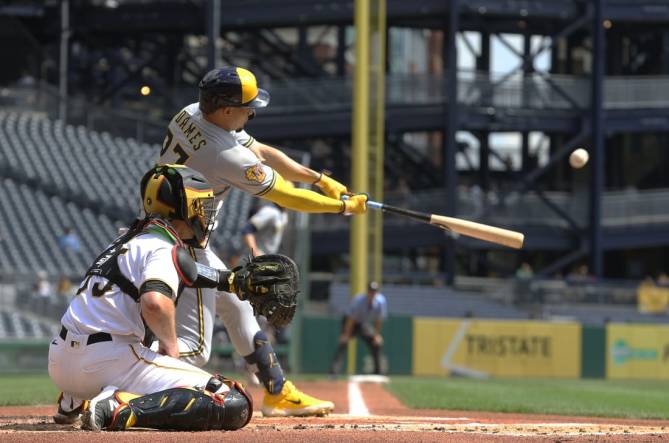 Sep 6, 2023; Pittsburgh, Pennsylvania, USA;  Milwaukee Brewers shortstop Willy Adames (27) hits a three run home run against the Pittsburgh Pirates during the first inning at PNC Park. Mandatory Credit: Charles LeClaire-USA TODAY Sports
