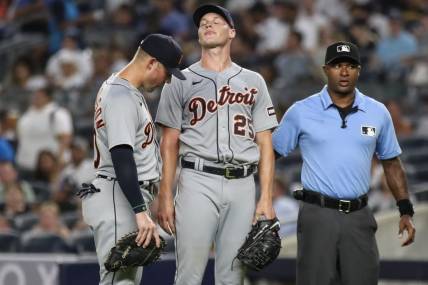 Sep 6, 2023; Bronx, New York, USA;  Detroit Tigers first baseman Spencer Torkelson (20) checks on starting pitcher Matt Manning (25) after he was hit by a line drive in the first inning against the New York Yankees at Yankee Stadium. Mandatory Credit: Wendell Cruz-USA TODAY Sports