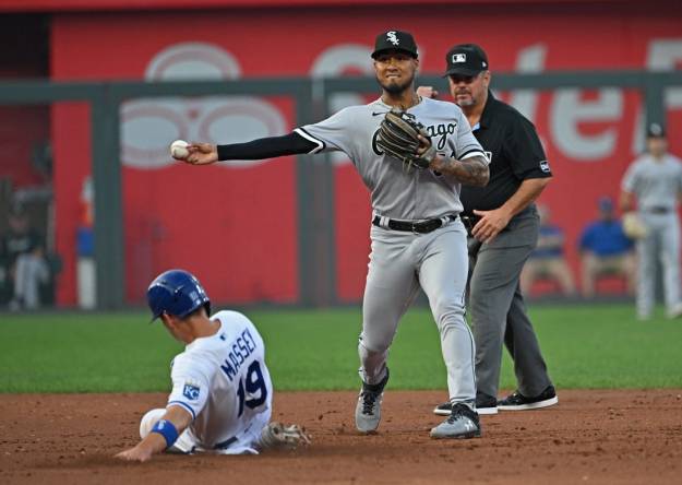 Sep 6, 2023; Kansas City, Missouri, USA;  Chicago White Sox second baseman Lenyn Sosa (50) throws the ball to first base for a double play over Kansas City Royals Michael Massey (19) in the second inning at Kauffman Stadium. Mandatory Credit: Peter Aiken-USA TODAY Sports