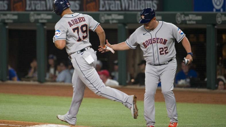 Sep 6, 2023; Arlington, Texas, USA; Houston Astros first baseman Jose Abreu (79) rounds first base past first base coach Omar L pez (22) after Abreu hits a grand slam home run against the Texas Rangers during the third inning at Globe Life Field. Mandatory Credit: Jerome Miron-USA TODAY Sports