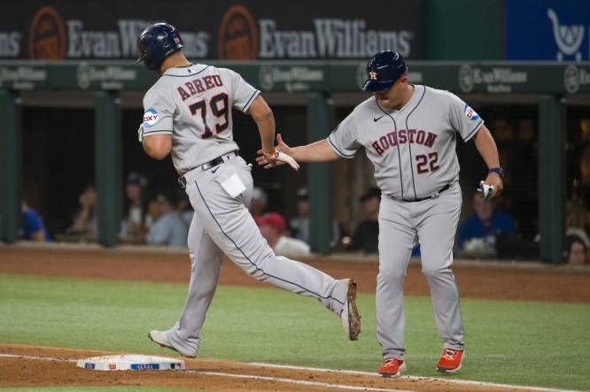 Sep 6, 2023; Arlington, Texas, USA; Houston Astros first baseman Jose Abreu (79) rounds first base past first base coach Omar L pez (22) after Abreu hits a grand slam home run against the Texas Rangers during the third inning at Globe Life Field. Mandatory Credit: Jerome Miron-USA TODAY Sports