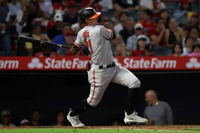 Sep 6, 2023; Anaheim, California, USA;  Baltimore Orioles left fielder Austin Hays (21) hits an RBI single during the third inning against the Los Angeles Angels at Angel Stadium. Mandatory Credit: Kiyoshi Mio-USA TODAY Sports
