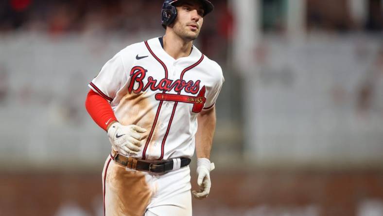 Sep 7, 2023; Atlanta, Georgia, USA; Atlanta Braves first baseman Matt Olson (28) hits a home run against the St. Louis Cardinals in the fifth inning at Truist Park. Mandatory Credit: Brett Davis-USA TODAY Sports