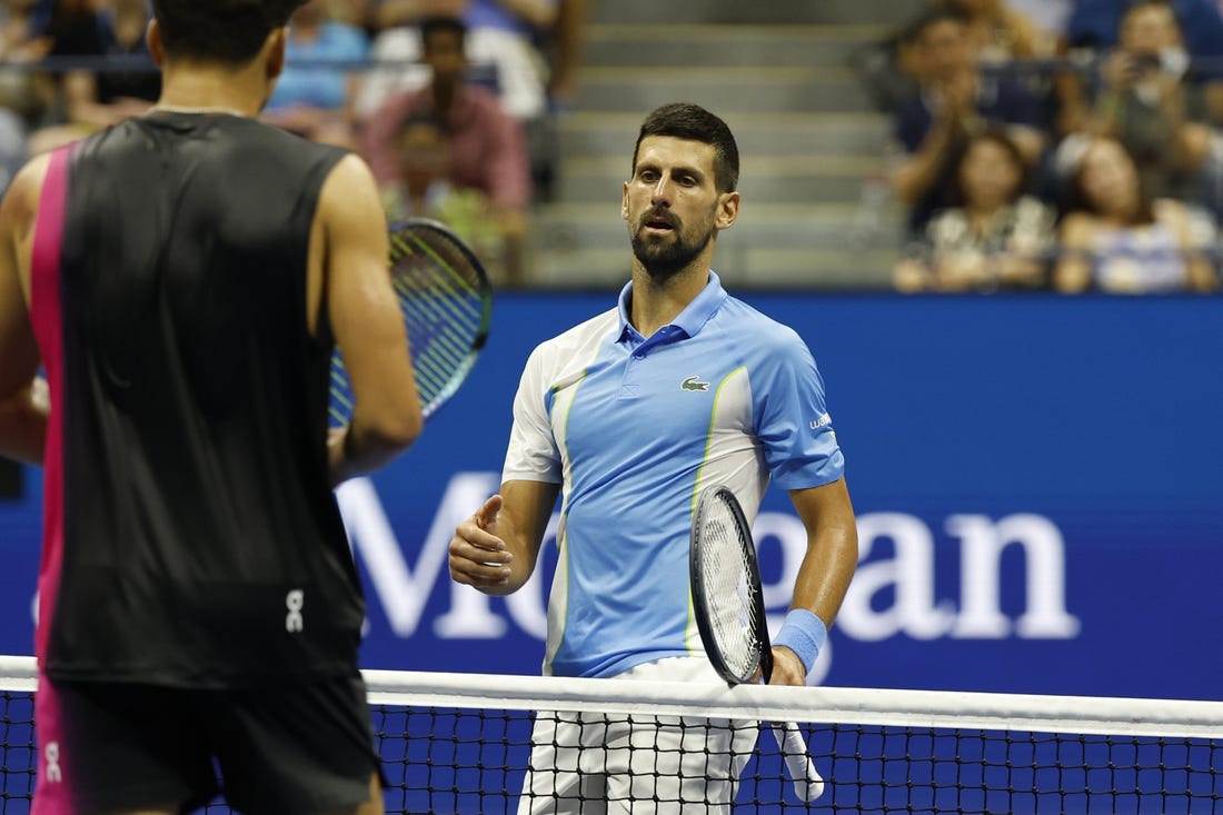 Sep 8, 2023; Flushing, NY, USA; Novak Djokovic of Serbia shakes hands with Ben Shelton of the United States (L) after their match in a men's singles semifinal on day twelve of the 2023 U.S. Open tennis tournament at USTA Billie Jean King Tennis Center. Mandatory Credit: Geoff Burke-USA TODAY Sports