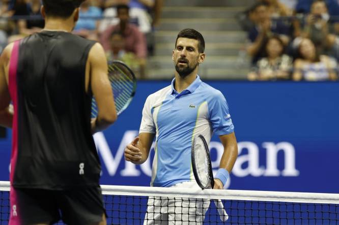 Sep 8, 2023; Flushing, NY, USA; Novak Djokovic of Serbia shakes hands with Ben Shelton of the United States (L) after their match in a men's singles semifinal on day twelve of the 2023 U.S. Open tennis tournament at USTA Billie Jean King Tennis Center. Mandatory Credit: Geoff Burke-USA TODAY Sports