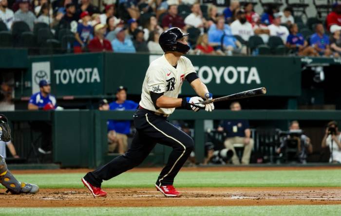 Sep 8, 2023; Arlington, Texas, USA;  Texas Rangers shortstop Corey Seager (5) hits a two-run home run during the first inning against the Oakland Athletics at Globe Life Field. Mandatory Credit: Kevin Jairaj-USA TODAY Sports