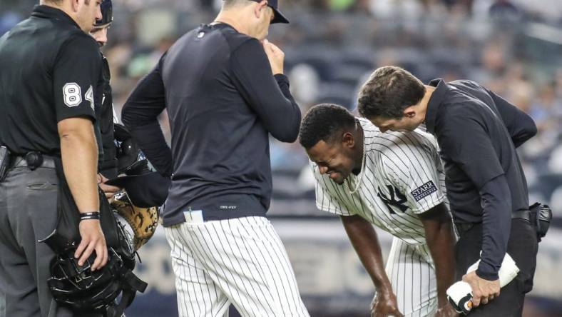 Sep 8, 2023; Bronx, New York, USA;  New York Yankees starting pitcher Luis Severino (40) grimaces after getting injured in the fifth inning against the Milwaukee Brewers at Yankee Stadium. Mandatory Credit: Wendell Cruz-USA TODAY Sports