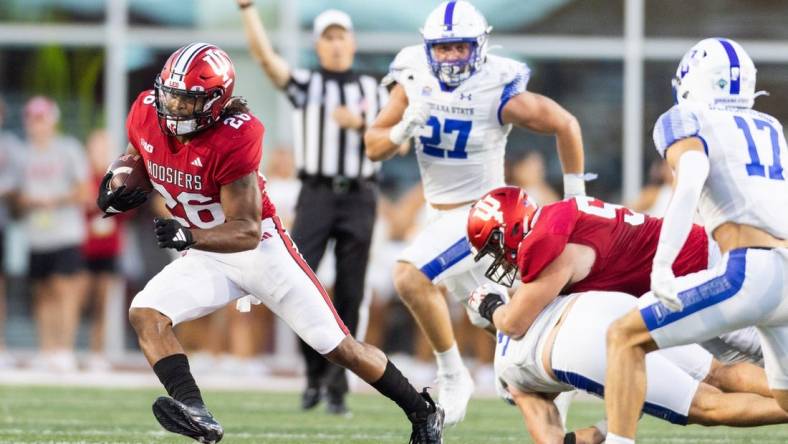 Sep 8, 2023; Bloomington, Indiana, USA; Indiana Hoosiers running back Josh Henderson (26) runs the ball in the first half against the Indiana State Sycamores at Memorial Stadium. Mandatory Credit: Trevor Ruszkowski-USA TODAY Sports