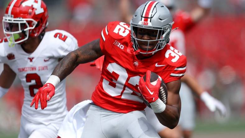 Sep 9, 2023; Columbus, Ohio, USA;  Ohio State Buckeyes running back TreVeyon Henderson (32) ryuns for the touchdown during the second quarter against the Youngstown State Penguins at Ohio Stadium. Mandatory Credit: Joseph Maiorana-USA TODAY Sports