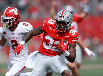 Sep 9, 2023; Columbus, Ohio, USA;  Ohio State Buckeyes running back TreVeyon Henderson (32) ryuns for the touchdown during the second quarter against the Youngstown State Penguins at Ohio Stadium. Mandatory Credit: Joseph Maiorana-USA TODAY Sports