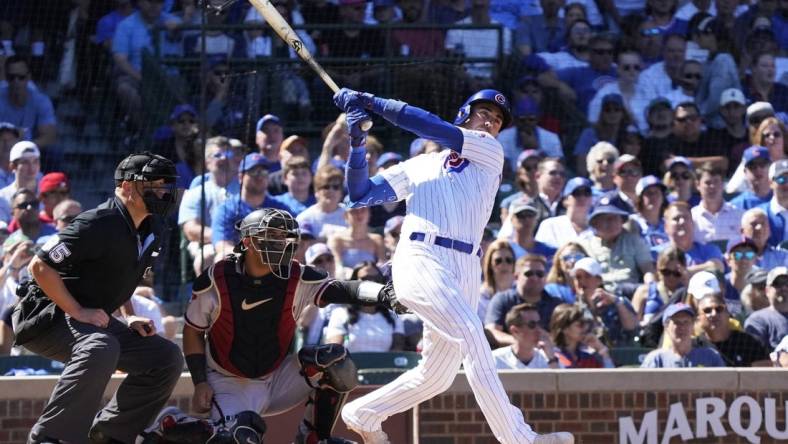 Sep 9, 2023; Chicago, Illinois, USA; Chicago Cubs first baseman Cody Bellinger (24) hits a RBI single against the Arizona Diamondbacks during the third inningat Wrigley Field. Mandatory Credit: David Banks-USA TODAY Sports