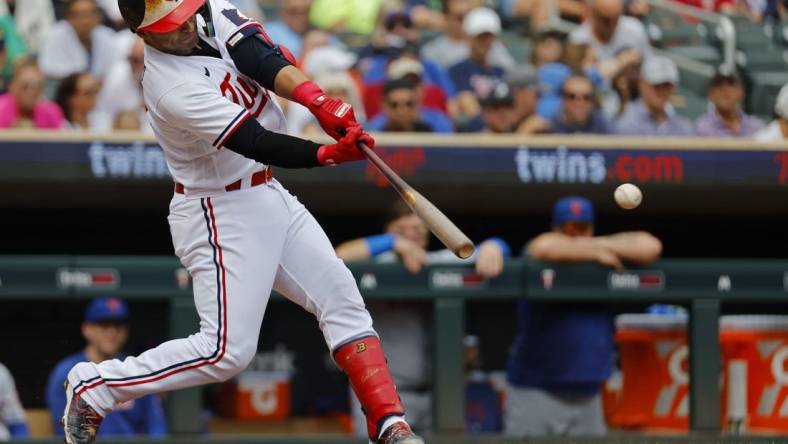 Sep 9, 2023; Minneapolis, Minnesota, USA; Minnesota Twins first baseman Donovan Solano (39) hits a two-run single against the New York Mets in the second inning at Target Field. Mandatory Credit: Bruce Kluckhohn-USA TODAY Sports