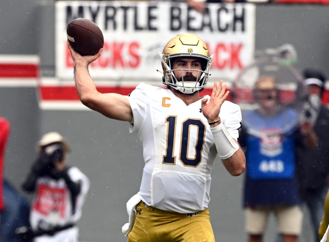 Sep 9, 2023; Raleigh, North Carolina, USA;Notre Dame Fighting Irish quarterback Sam Hartman (10) throws a pass during the first half against the North Carolina State Wolfpack at Carter-Finley Stadium. Mandatory Credit: Rob Kinnan-USA TODAY Sports