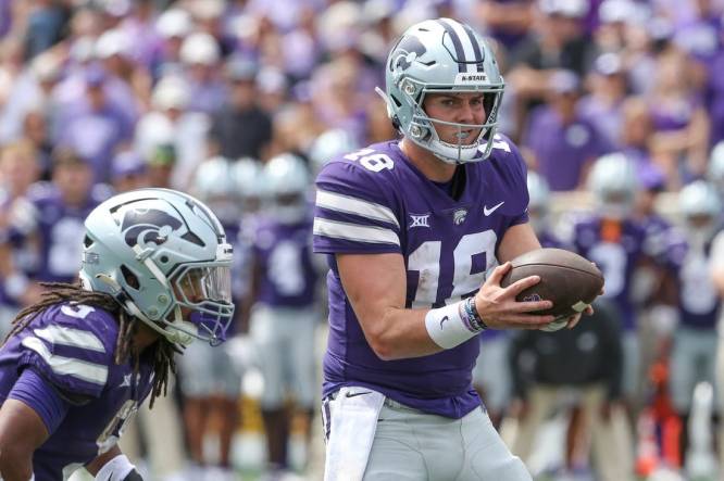 Sep 9, 2023; Manhattan, Kansas, USA; Kansas State Wildcats quarterback Will Howard (18) fakes a handoff to wide receiver RJ Garcia II (3) during the fourth quarter against the Troy Trojans at Bill Snyder Family Football Stadium. Mandatory Credit: Scott Sewell-USA TODAY Sports