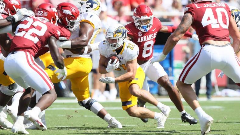 Sep 9, 2023; Fayetteville, Arkansas, USA; Kent State Golden Flashes running back Gavin Garcia (21) rushes in the first quarter against the Arkansas Razorbacks at Donald W. Reynolds Razorback Stadium. Mandatory Credit: Nelson Chenault-USA TODAY Sports