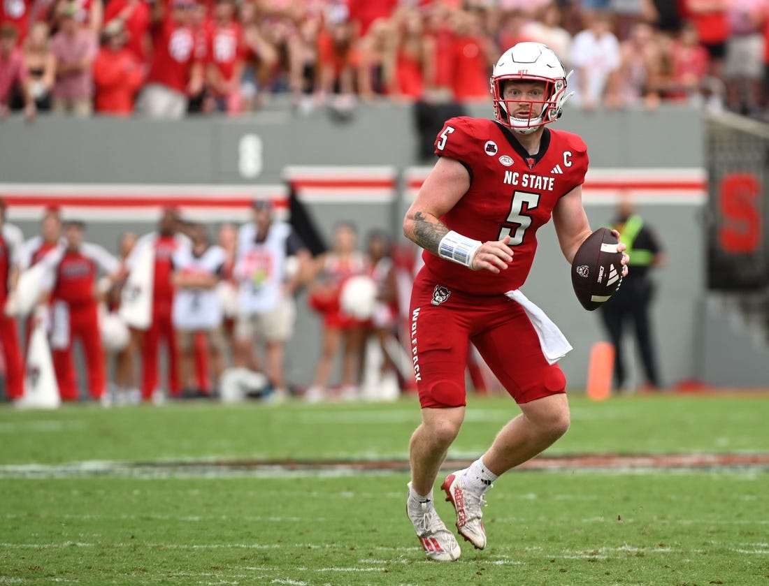 Sep 9, 2023; Raleigh, North Carolina, USA; North Carolina State Wolfpack quarterback Brennan Armstrong (5) looks to pass during the second half against the Notre Dame Fighting Irish at Carter-Finley Stadium. Mandatory Credit: Rob Kinnan-USA TODAY Sports