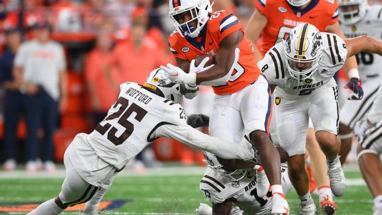 Sep 9, 2023; Syracuse, New York, USA; Syracuse Orange running back Juwaun Price (28) runs with the ball as Western Michigan Broncos cornerback Aaron Wofford (25) defends during the first half at the JMA Wireless Dome. Mandatory Credit: Rich Barnes-USA TODAY Sports