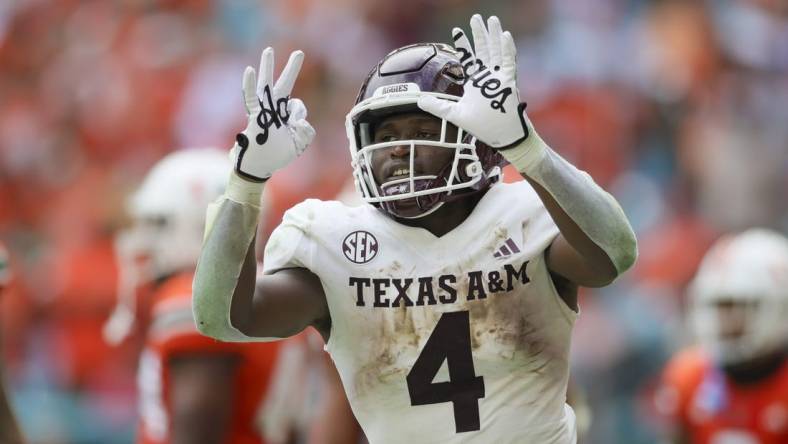 Sep 9, 2023; Miami Gardens, Florida, USA; Texas A&M Aggies running back Amari Daniels (4) reacts after scoring a touchdown against the Miami Hurricanes during the second quarter at Hard Rock Stadium. Mandatory Credit: Sam Navarro-USA TODAY Sports