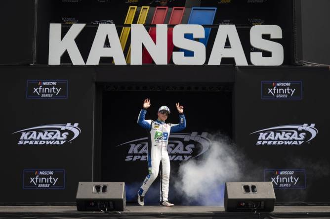 Sep 9, 2023; Kansas City, Kansas, USA; NASCAR Xfinity Series driver John Hunter Nemechek (20) is introduced before the Xfinity Series Kansas Lottery 300 at Kansas Speedway. Mandatory Credit: Amy Kontras-USA TODAY Sports