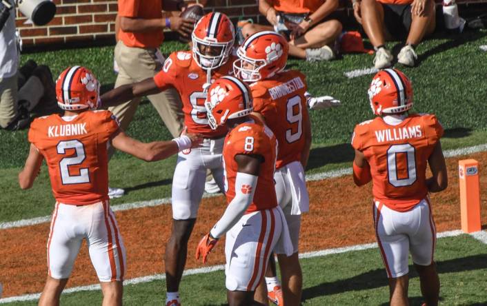 Sep 9, 2023; Clemson, South Carolina, USA; Clemson wide receiver Beaux Collins (80) celebrates with quarterback Cade Klubnik (2) and teammates after his touchdown during the third quarter at Memorial Stadium. Mandatory Credit: Ken Ruinard-USA TODAY Sports