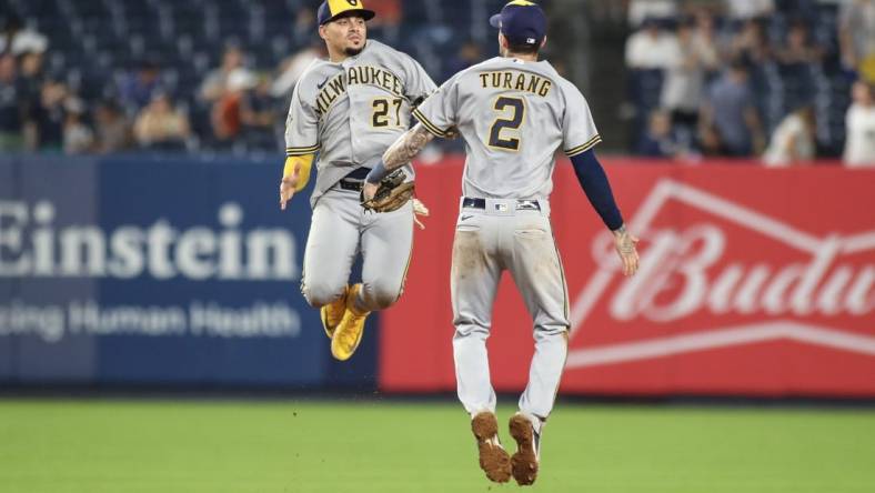 Sep 9, 2023; Bronx, New York, USA;  Milwaukee Brewers shortstop Willy Adames (27) and second baseman Brice Turang (2) celebrate after defeating the New York Yankees 9-2 at Yankee Stadium. Mandatory Credit: Wendell Cruz-USA TODAY Sports