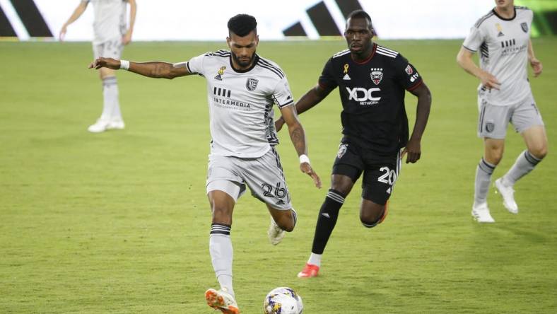 Sep 9, 2023; Washington, District of Columbia, USA; San Jose Earthquakes defender Rodrigues (26) kicks the ball away from D.C. United forward Christian Benteke (20) during the first half at Audi Field. Mandatory Credit: Amber Searls-USA TODAY Sports