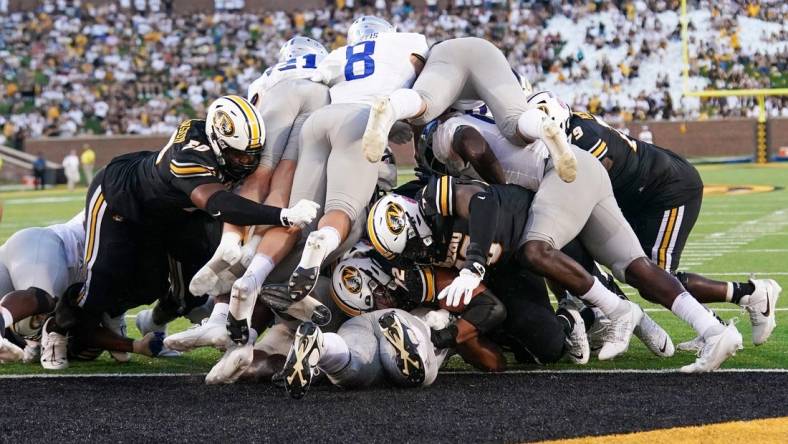 Sep 9, 2023; Columbia, Missouri, USA; Missouri Tigers quarterback Brady Cook (12) punches in for a touchdown against the Middle Tennessee Blue Raiders during the first half at Faurot Field at Memorial Stadium. Mandatory Credit: Denny Medley-USA TODAY Sports