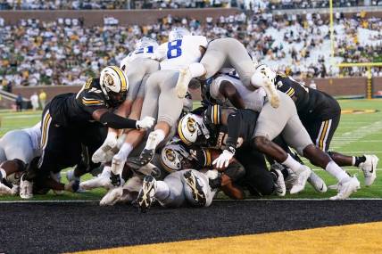 Sep 9, 2023; Columbia, Missouri, USA; Missouri Tigers quarterback Brady Cook (12) punches in for a touchdown against the Middle Tennessee Blue Raiders during the first half at Faurot Field at Memorial Stadium. Mandatory Credit: Denny Medley-USA TODAY Sports
