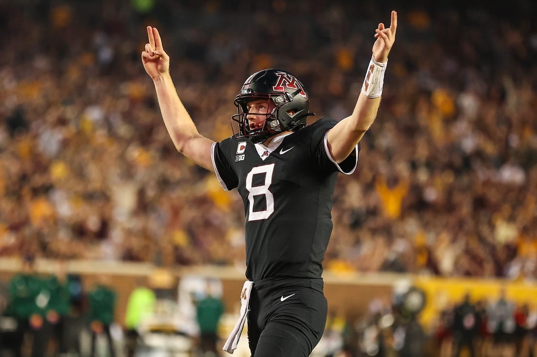 Sep 9, 2023; Minneapolis, Minnesota, USA; Minnesota Golden Gophers quarterback Athan Kaliakmanis (8) celebrates running back Darius Taylors (1) touchdown during the second quarter against the Eastern Michigan Eagles at Huntington Bank Stadium. Mandatory Credit: Matt Krohn-USA TODAY Sports