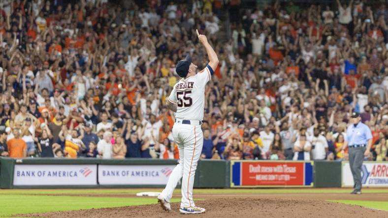 Sep 9, 2023; Houston, Texas, USA; Houston Astros relief pitcher Ryan Pressly (55) celebrates the win after defeating the San Diego Padres at Minute Maid Park. Mandatory Credit: Thomas Shea-USA TODAY Sports