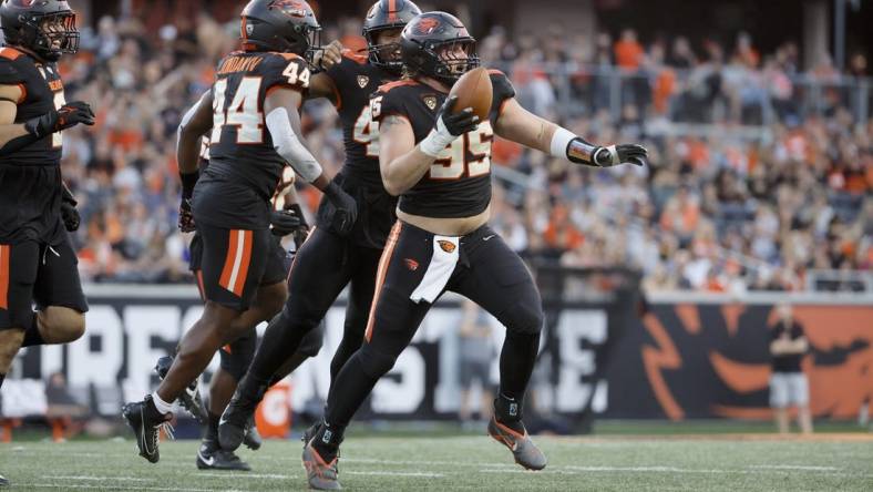 Sep 9, 2023; Corvallis, Oregon, USA; Oregon State Beavers defensive lineman Isaac Hodgins (99) celebrates after recovering a fumble against the UC Davis Aggies during the first half at Reser Stadium. Mandatory Credit: Soobum Im-USA TODAY Sports