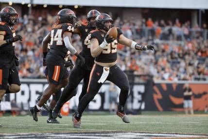 Sep 9, 2023; Corvallis, Oregon, USA; Oregon State Beavers defensive lineman Isaac Hodgins (99) celebrates after recovering a fumble against the UC Davis Aggies during the first half at Reser Stadium. Mandatory Credit: Soobum Im-USA TODAY Sports