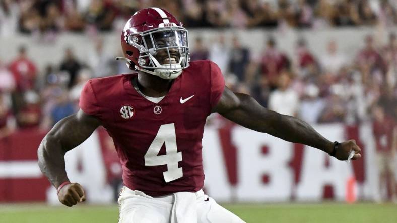 Sep 9, 2023; Tuscaloosa, Alabama, USA;  Alabama Crimson Tide quarterback Jalen Milroe (4) celebrates after hitting Alabama Crimson Tide wide receiver Jermaine Burton (3) for a touchdown at Bryant-Denny Stadium. Texas defeated Alabama 34-24. Mandatory Credit: Gary Cosby Jr. -USA TODAY Sports