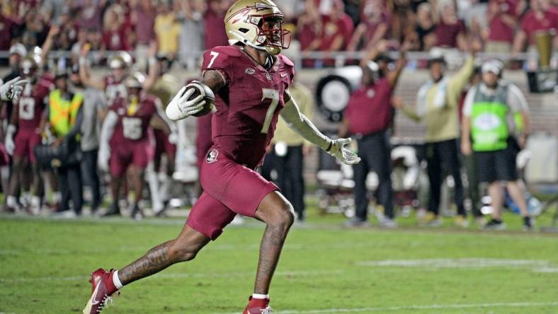 Sep 9, 2023; Tallahassee, Florida, USA; Florida State Seminoles defensive back Jarrian Jones (7) intercepts a pass and takes it for a touchdown during the game against the Southern Miss Golden Eagles at Doak S. Campbell Stadium. Mandatory Credit: Melina Myers-USA TODAY Sports