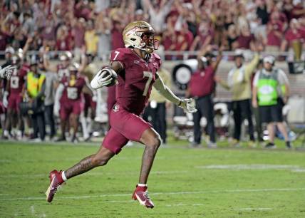 Sep 9, 2023; Tallahassee, Florida, USA; Florida State Seminoles defensive back Jarrian Jones (7) intercepts a pass and takes it for a touchdown during the game against the Southern Miss Golden Eagles at Doak S. Campbell Stadium. Mandatory Credit: Melina Myers-USA TODAY Sports