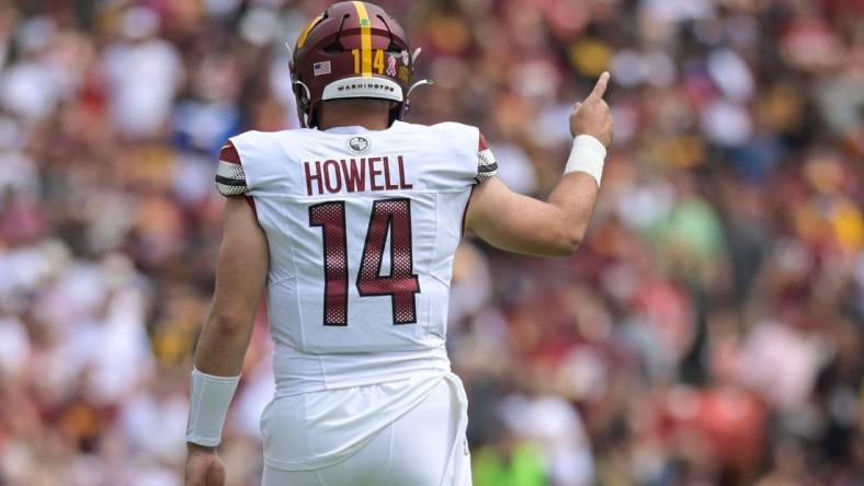 Sep 10, 2023; Landover, Maryland, USA; Washington Commanders quarterback Sam Howell (14) signals first down during the first quarter against the Arizona Cardinals  at FedExField. Mandatory Credit: Tommy Gilligan-USA TODAY Sports